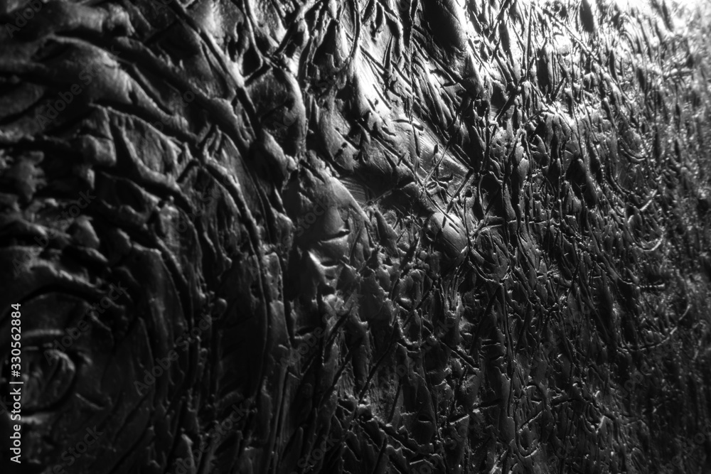 black and white plasticine texture on a modeling board