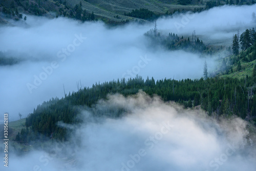 Clouds Weave in and Out of Forest Above Yellowstone River