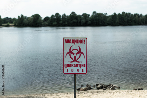 Sign with the inscription "Warning Quarantine zone". Quarantine zone sign in the infected area