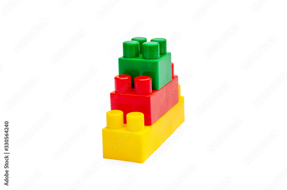 Naklejka premium Pyramid of colored toy bricks on white.