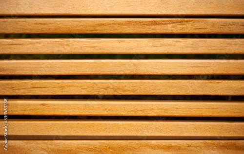 Close up of a wooden park bench