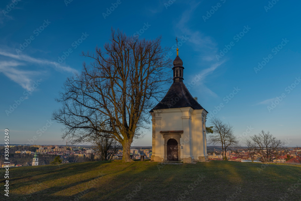 Chapel on hill over Trebic town in Moravia region in sunset evening