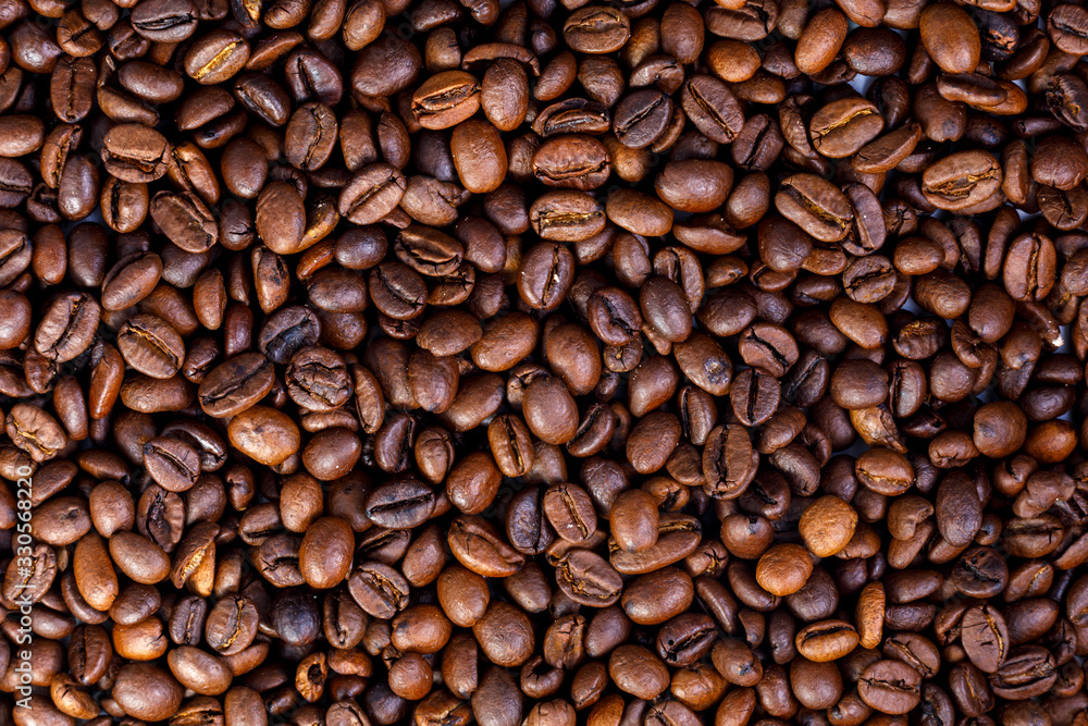 coffee beans are scattered on the table and take up all the space coffee beans are scattered on the table and take up all the space
