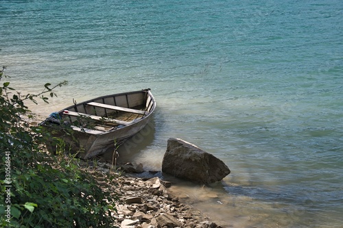 Stationary boats on the lake of santa croce