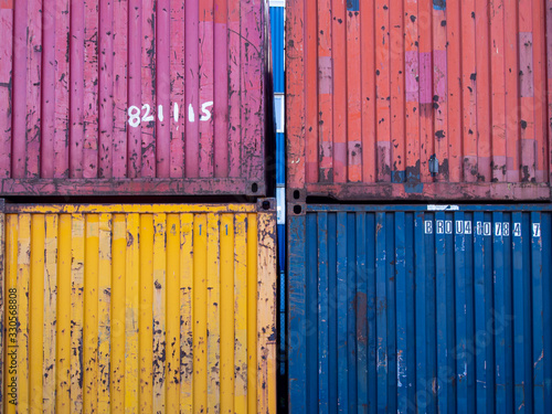 stack of multicoloured shipping containers