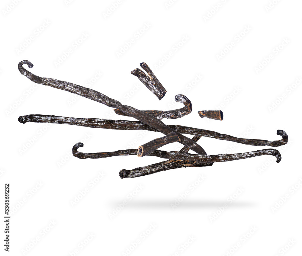 Obraz premium Dried vanilla sticks in the air, isolated on a white background.