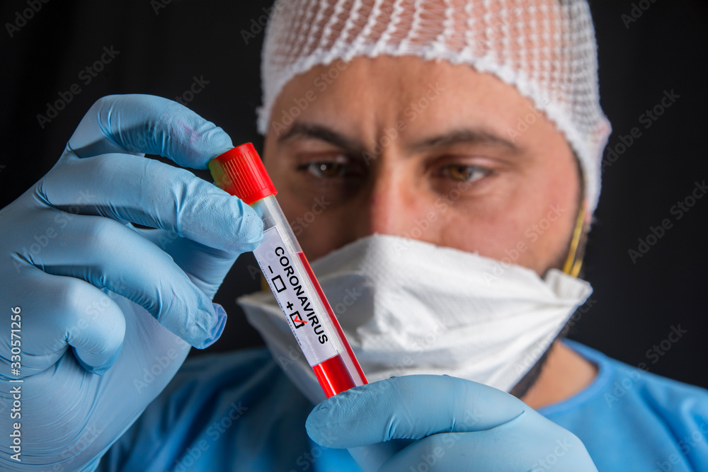 Blood sample test tube positive with label COVID-19 or novel coronavirus Blood sample test tube positive with label COVID-19 or novel coronavirus