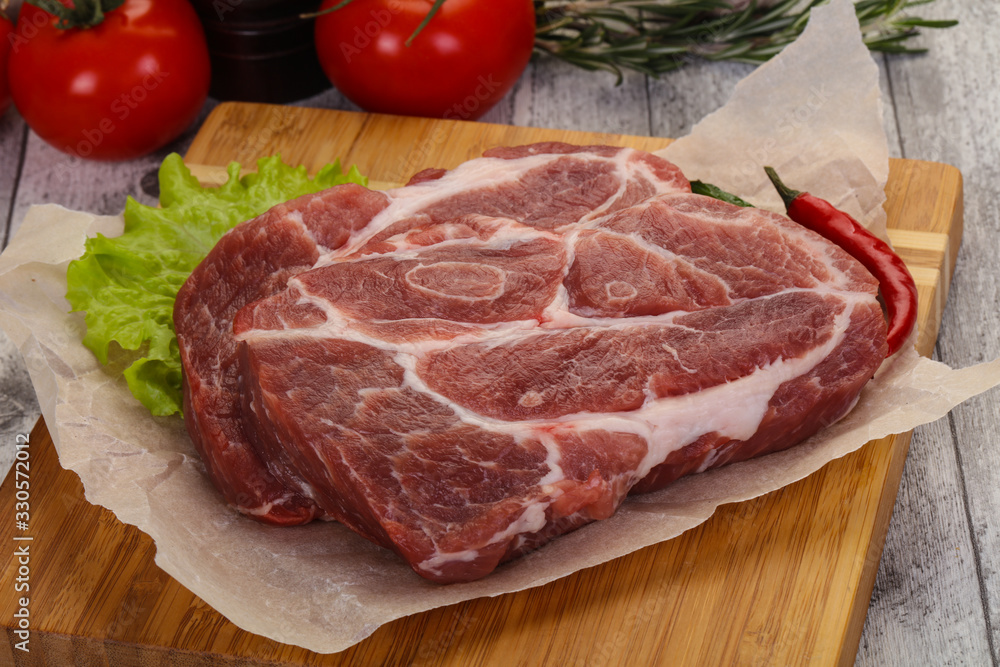 Raw pork neck steak