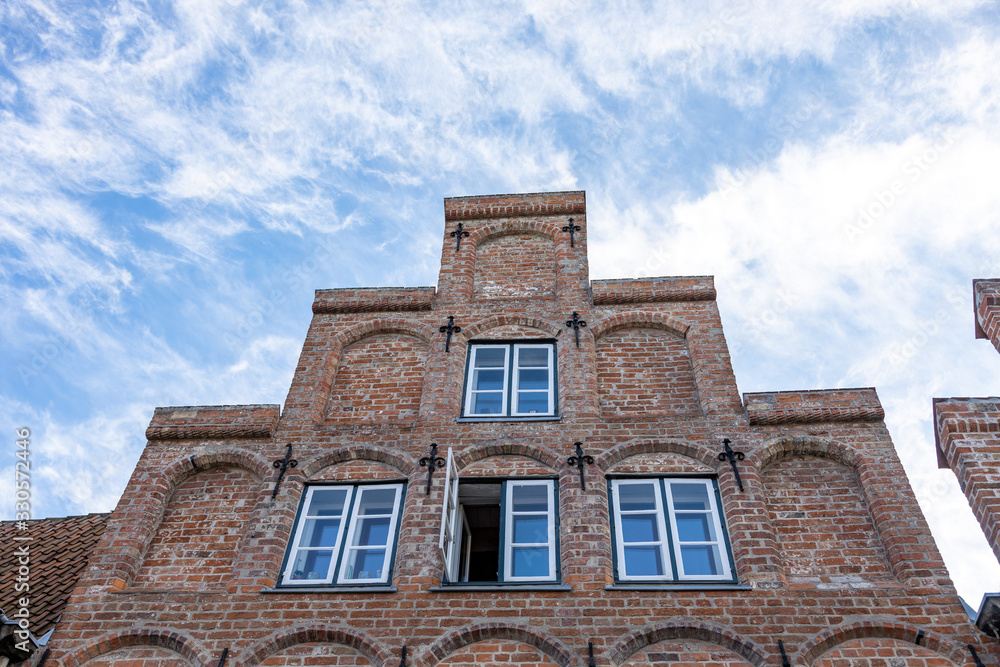 Lubeck, Germany, 10-06-2019 historic buildings with gothic brick facades in the old town Lubeck, Germany, 10-06-2019 historic buildings with gothic brick facades in the old town