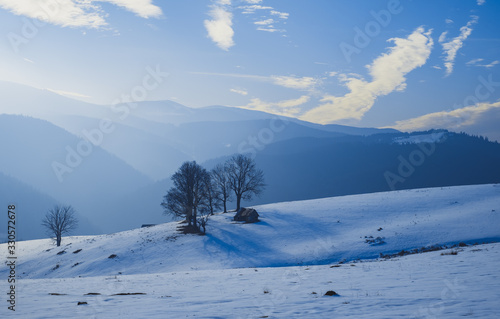 sun over the winter mountains with snow, Cindrel mountains, Paltinis, Romania © Roberto Sorin