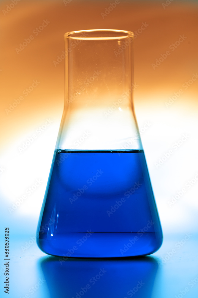 Retort with blue chemical reagent Retort with blue chemical reagent