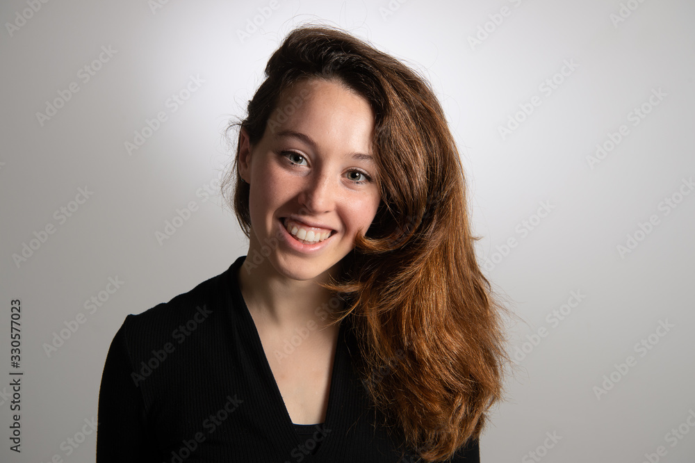 Portrait of attractive smiling young brunette girl. Isolated on white background. Beauty and hairstyle concept... Portrait of attractive smiling young brunette girl. Isolated on white background. Beauty and hairstyle concept...