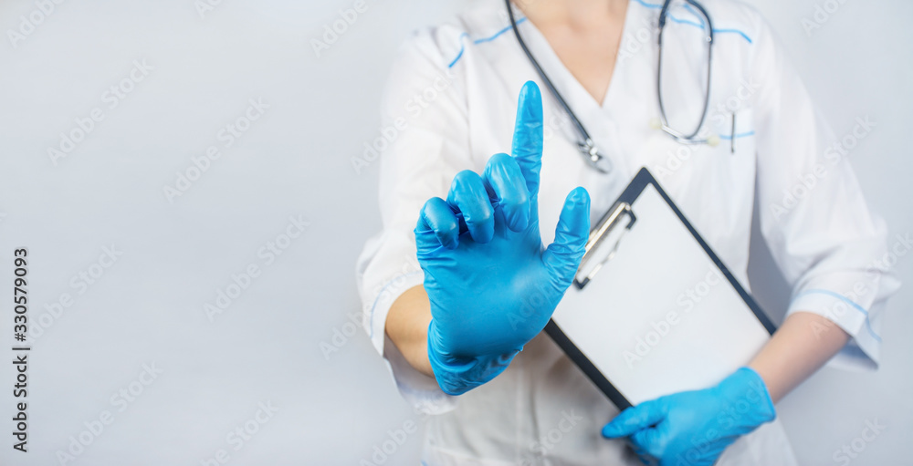 The doctor points a hand to an empty place. The concept of medicine. Banner. Copy space. The doctor points a hand to an empty place. The concept of medicine. Banner. Copy space.
