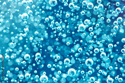 Macro Oxygen bubbles in water on blured background, concept such as ecology