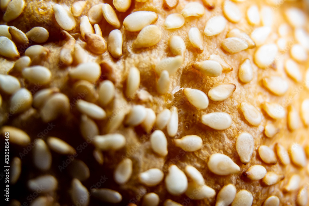 Bread, Burger with sesame seeds on the crust. Delicious and healthy Breakfast. Background, close-up. Bread, Burger with sesame seeds on the crust. Delicious and healthy Breakfast. Background, close-up.