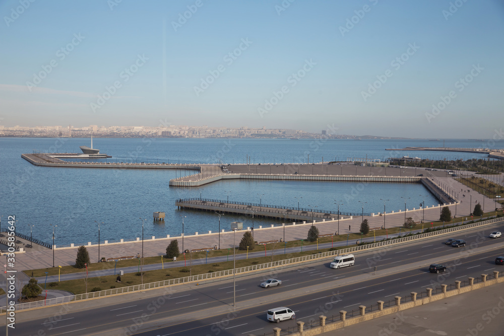 The sea, the sky and the roads. Seaports.Baku boulevard located on the shore of the Caspian Sea . New boulevard of Baku, the capital of Azerbaijan .