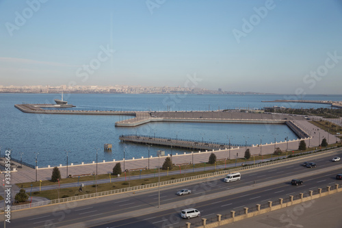 The sea, the sky and the roads. Seaports.Baku boulevard located on the shore of the Caspian Sea . New boulevard of Baku, the capital of Azerbaijan . © Adil