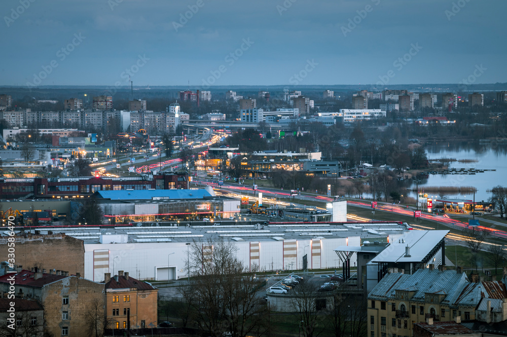 Panoramic, aerial view over Riga city. Scenic view over iconic church towers, old town and infrastructure.