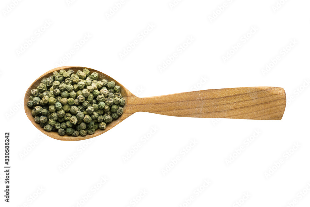 green peppercorn seeds in wooden spoon isolated on white background. spice for cooking food, top view.