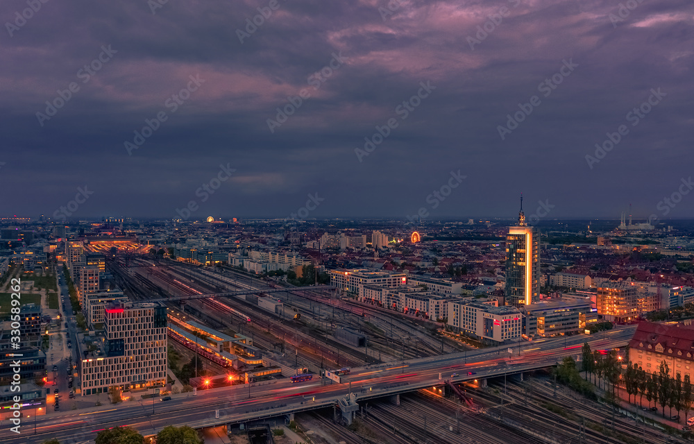 View over Munich at rush hour at the Donnersberger bridge with lights of cars in high angle view.