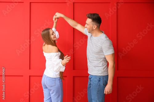 Happy young couple dancing ...