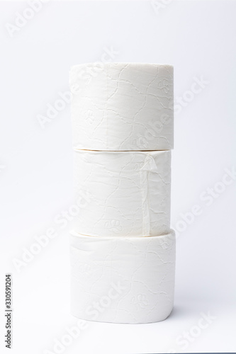 Symbol image for corona crisis panic buying / hoarding. Pile of toilet paper on white Background, with copy space.
