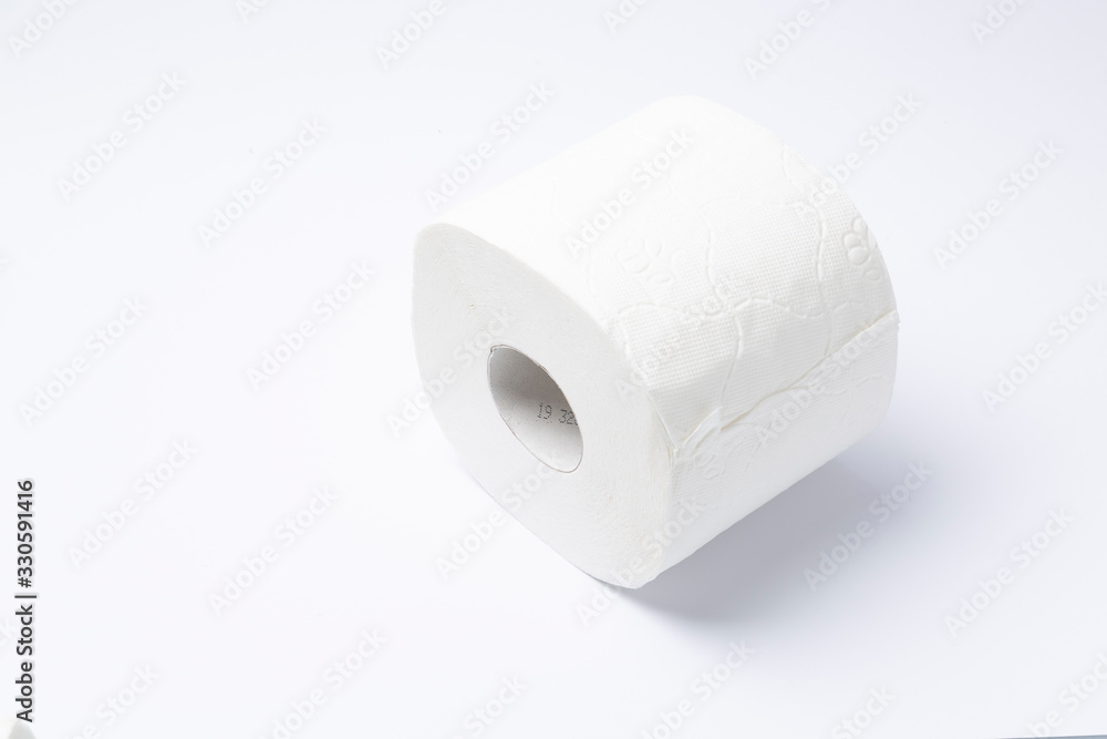 Symbol image for corona crisis panic buying / hoarding. Roll of toilet paper on white Background, with copy space. Symbol image for corona crisis panic buying / hoarding. Roll of toilet paper on white Background, with copy space.