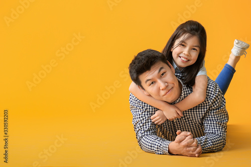 Happy Asian man and his lit...