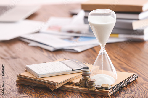 Hourglass, notebooks, calcu...