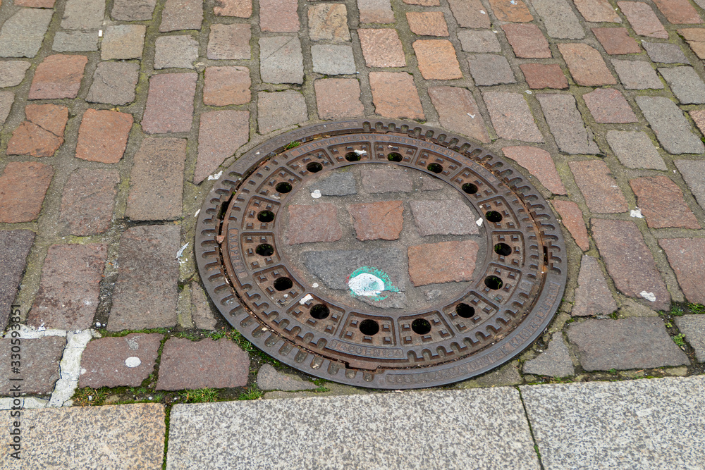 Iron manhole cover for the drainage of the road