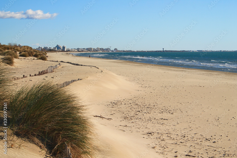 Sandy beach in Camargue region, in the South of France Sandy beach in Camargue region, in the South of France