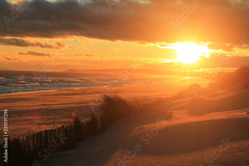 Sunset in natural sandy beach in Camargue region, France