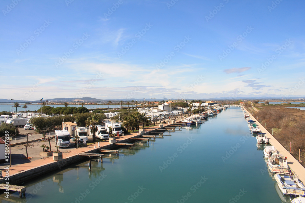 The Lez, a coastal river, and the motorhome area of in Palavas les flots, a seaside resort of the Languedoc coast in the south of Montpellier