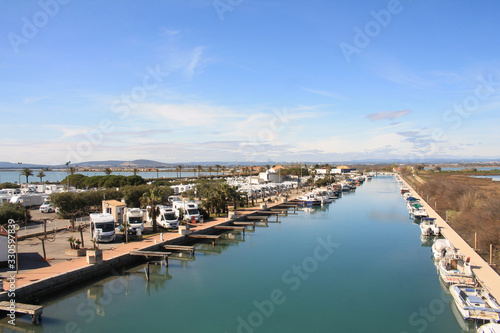 The Lez, a coastal river, and the motorhome area of in Palavas les flots, a seaside resort of the Languedoc coast in the south of Montpellier © Picturereflex