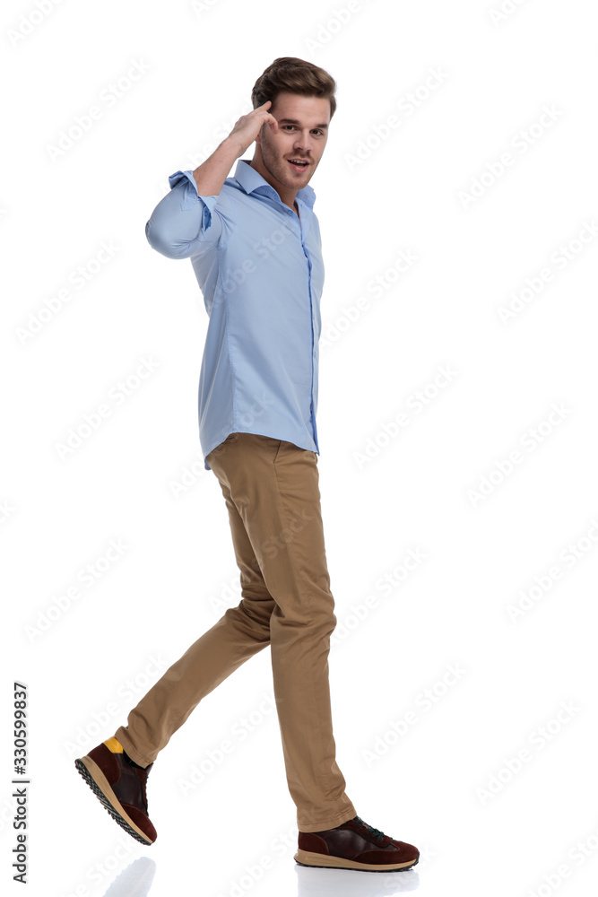 Side view of handsome casual man saluting Side view of handsome casual man saluting