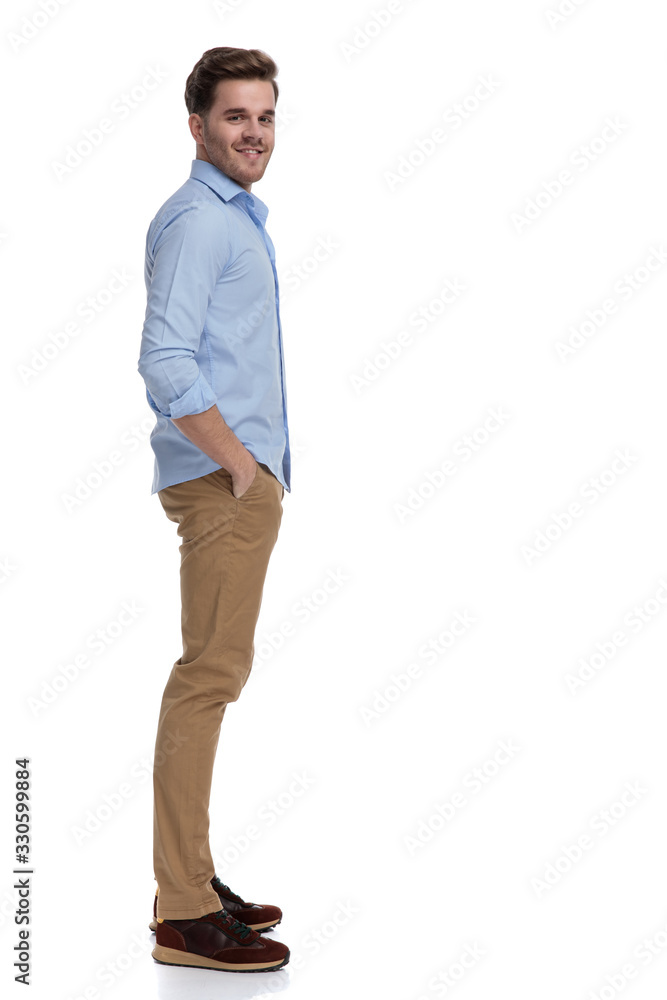 Side view of happy casual man smiling