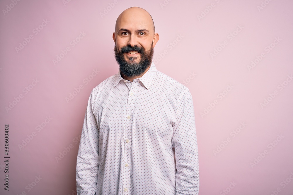 Handsome bald man with beard wearing elegant shirt over isolated pink background with a happy and cool smile on face. Lucky person. Handsome bald man with beard wearing elegant shirt over isolated pink background with a happy and cool smile on face. Lucky person.