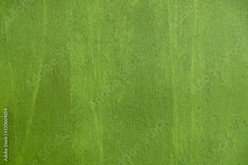 bright green concrete wall. rough surface texture