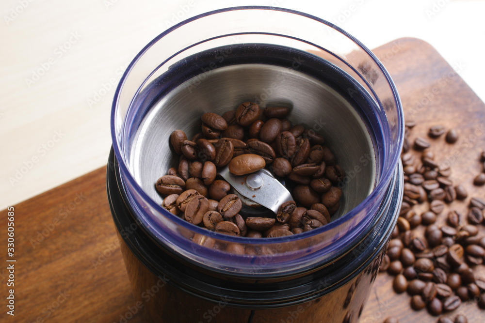 coffee beans in an electric coffee grinder coffee beans in an electric coffee grinder