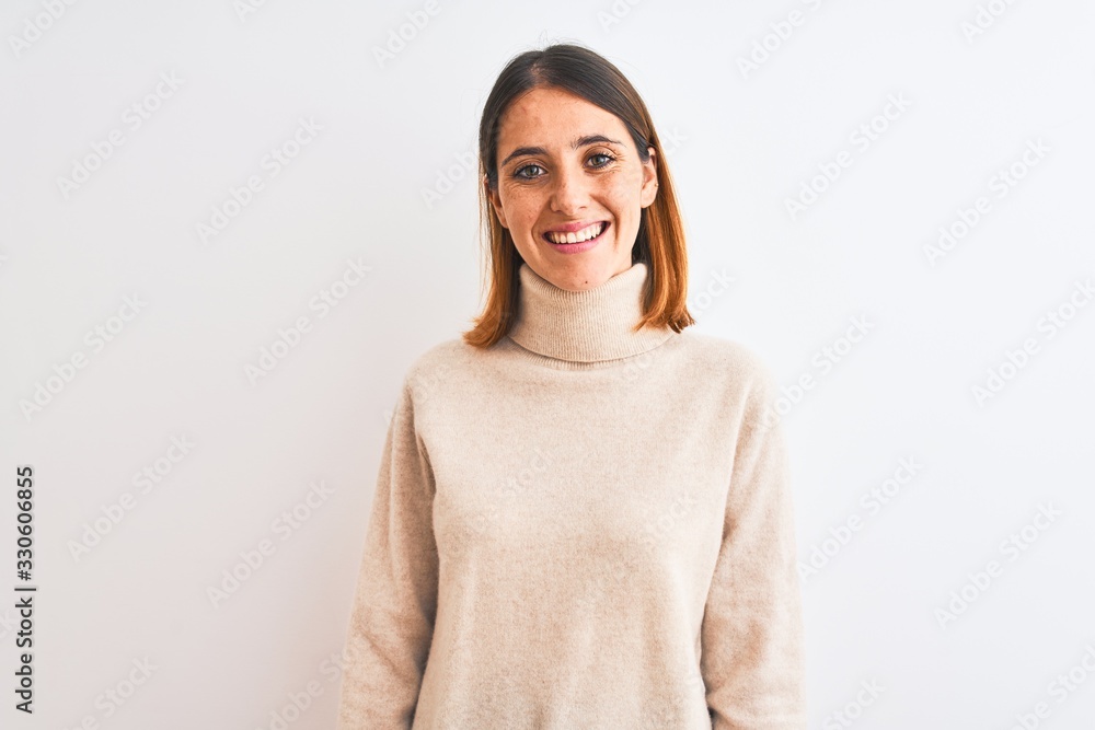 Beautiful redhead woman wearing winter turtleneck sweater over isolated background with a happy and cool smile on face. Lucky person. Beautiful redhead woman wearing winter turtleneck sweater over isolated background with a happy and cool smile on face. Lucky person.