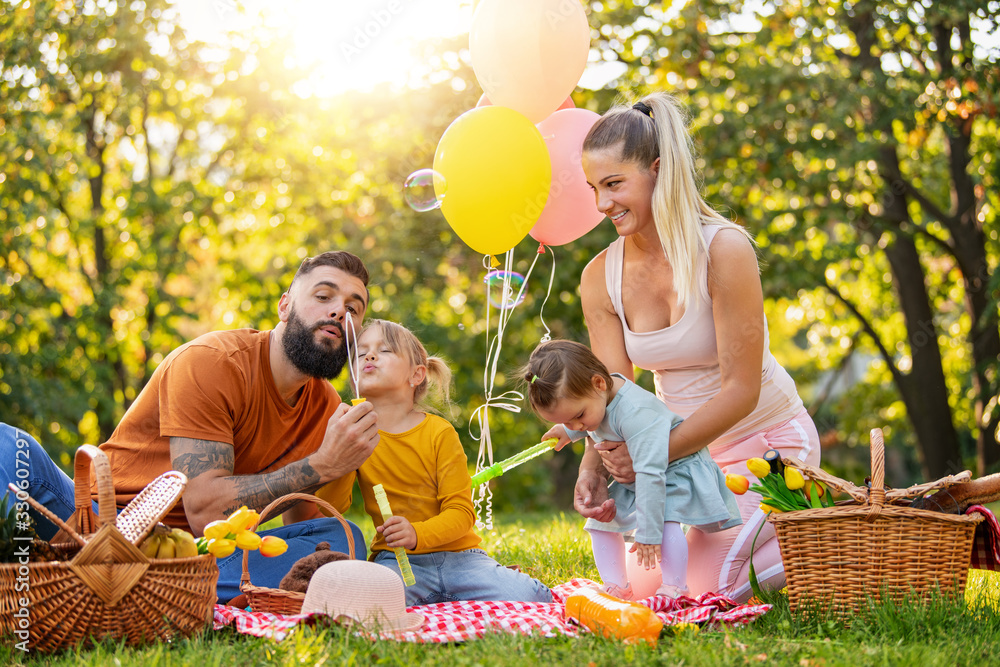 Happy family in the park together on a sunny day Happy family in the park together on a sunny day