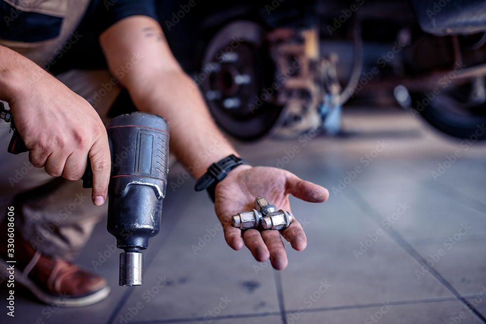Car mechanic in workshop
