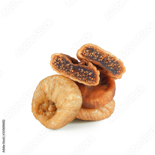 Dried figs, three whole fruits and halves with seeds isolated on white background 