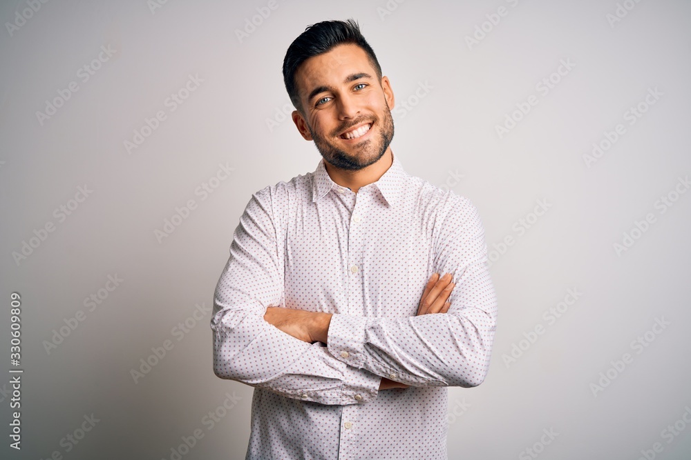 Young handsome man wearing elegant shirt standing over isolated white background happy face smiling with crossed arms looking at the camera. Positive person. Young handsome man wearing elegant shirt standing over isolated white background happy face smiling with crossed arms looking at the camera. Positive person.