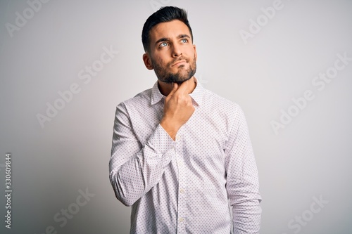 Young handsome man wearing elegant shirt standing over isolated white background Touching painful neck, sore throat for flu, clod and infection