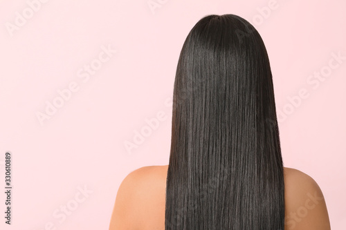 Obraz na plátně Young Asian woman with beautiful long hair on color background