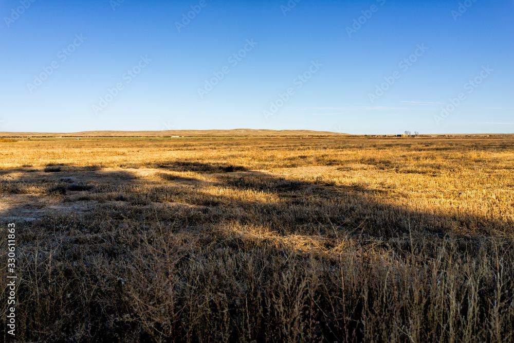 La Junta, Colorado landscape view near Bents Old Fort national park with rural countryside in autumn and farm fields