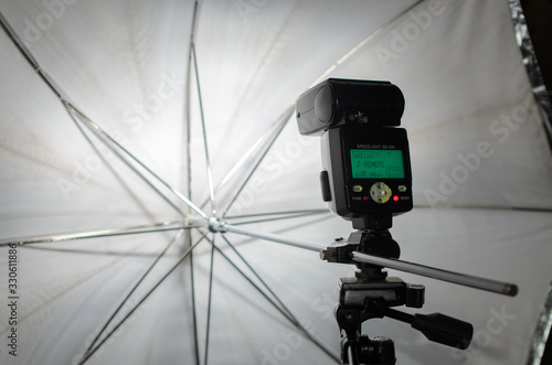 photoflash and umbrella on a stand © Сергей Киселёв