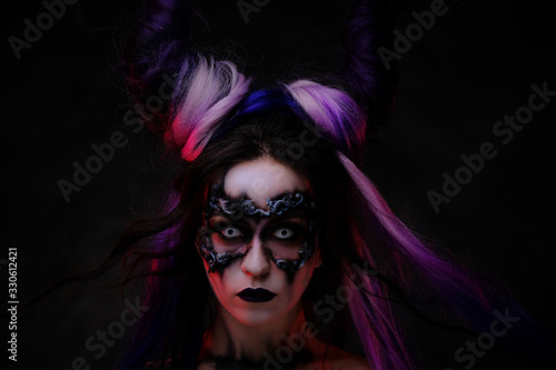 Canvas Print Close up photo of a banshee young girl in a magic creature cosplay, wearing dark