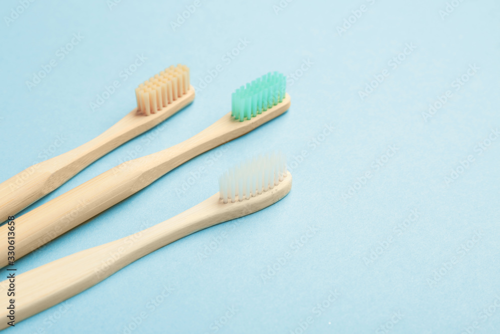 Wooden tooth brushes on color background Wooden tooth brushes on color background